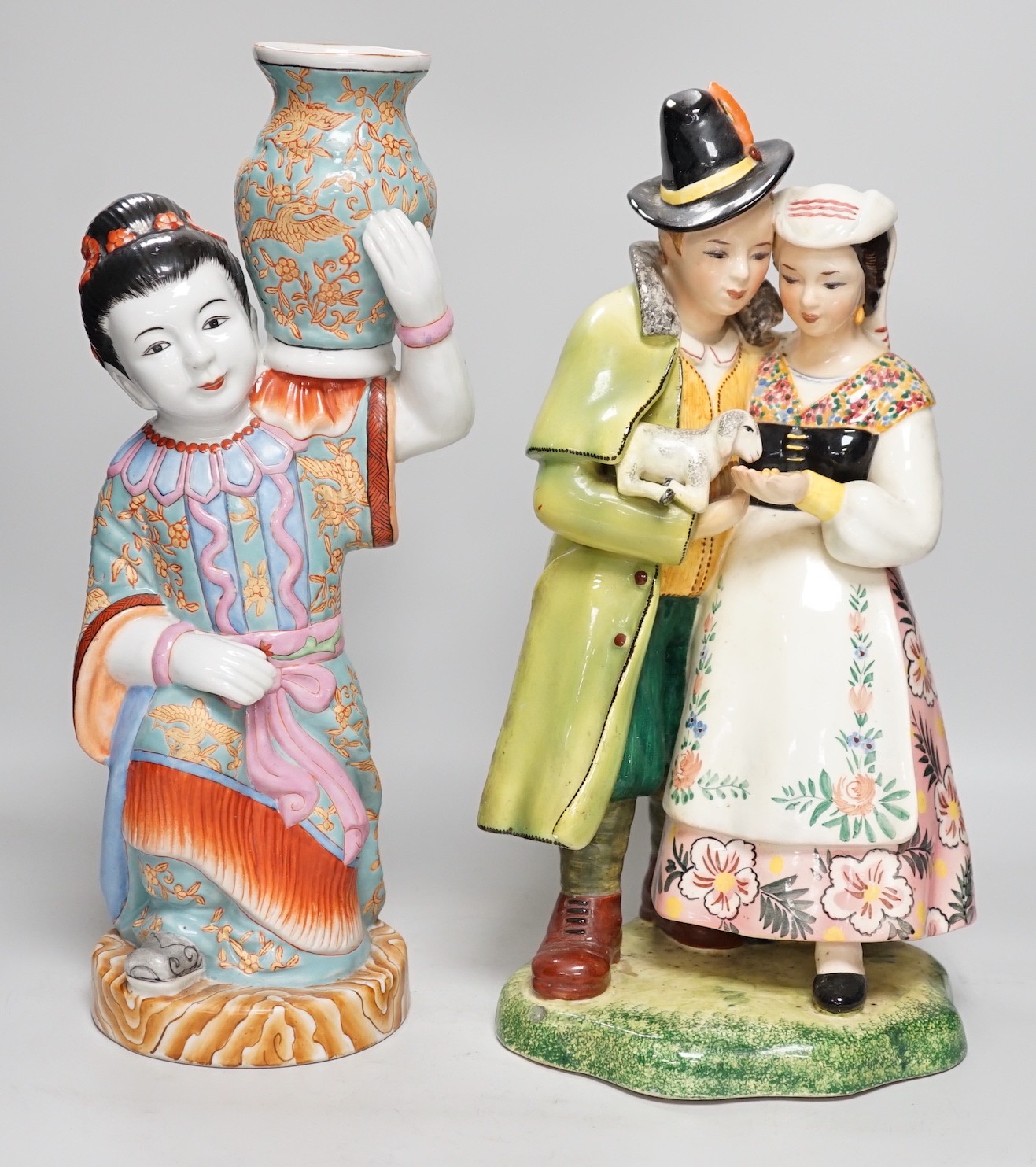 A Chinese porcelain figure of a lady together with a continental porcelain figure group, tallest 38cm